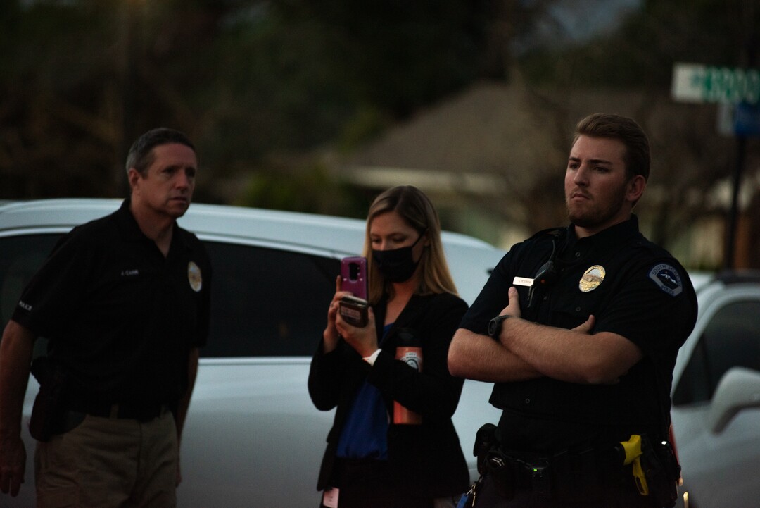 (Niki Chan Wylie |Special to The Tribune) Officer Jeff Petersen guards the gated entrance as a police team works on detonating explosive material found inside a home in South Jordan on Friday, July 24.