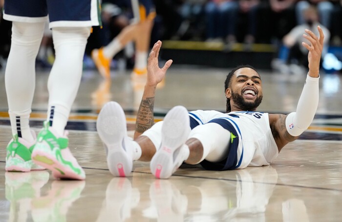 (Francisco Kjolseth | The Salt Lake Tribune) Minnesota Timberwolves guard D'Angelo Russell (0) looks to the referee in hopes of a fowl call by the Jazz in NBA action between the Utah Jazz and the Minnesota Timberwolves at Vivint Smart Home Arena in Salt Lake City, Thursday, Dec. 23, 2021.