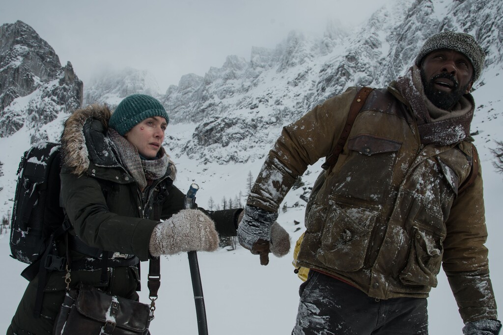 (Kimberley French  |  20th Century Fox)  Kate Winslet (left) and Idris Elba plays strangers who must rely on each other for survival, after their small plane crashes in the High Uintas, in the drama "The Mountain Between Us."