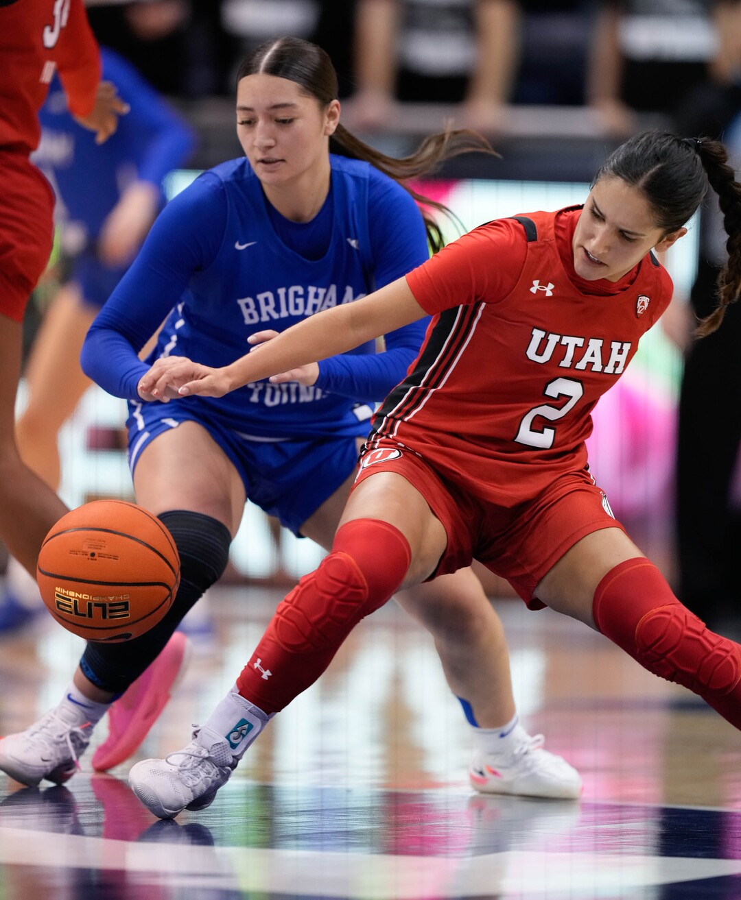(Francisco Kjolseth | The Salt Lake Tribune) BYU Cougars guard Nani Falatea (3) and Utah Utes guard Ines Vieira (2) battle for a loose ball in basketball action between the Utah Utes and the Brigham Young Cougars, at the Marriott Center in Provo, on Saturday, Dec. 10, 2022.