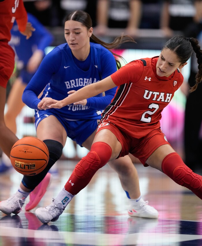 (Francisco Kjolseth | The Salt Lake Tribune) BYU Cougars guard Nani Falatea (3) and Utah Utes guard Ines Vieira (2) battle for a loose ball in basketball action between the Utah Utes and the Brigham Young Cougars, at the Marriott Center in Provo, on Saturday, Dec. 10, 2022.