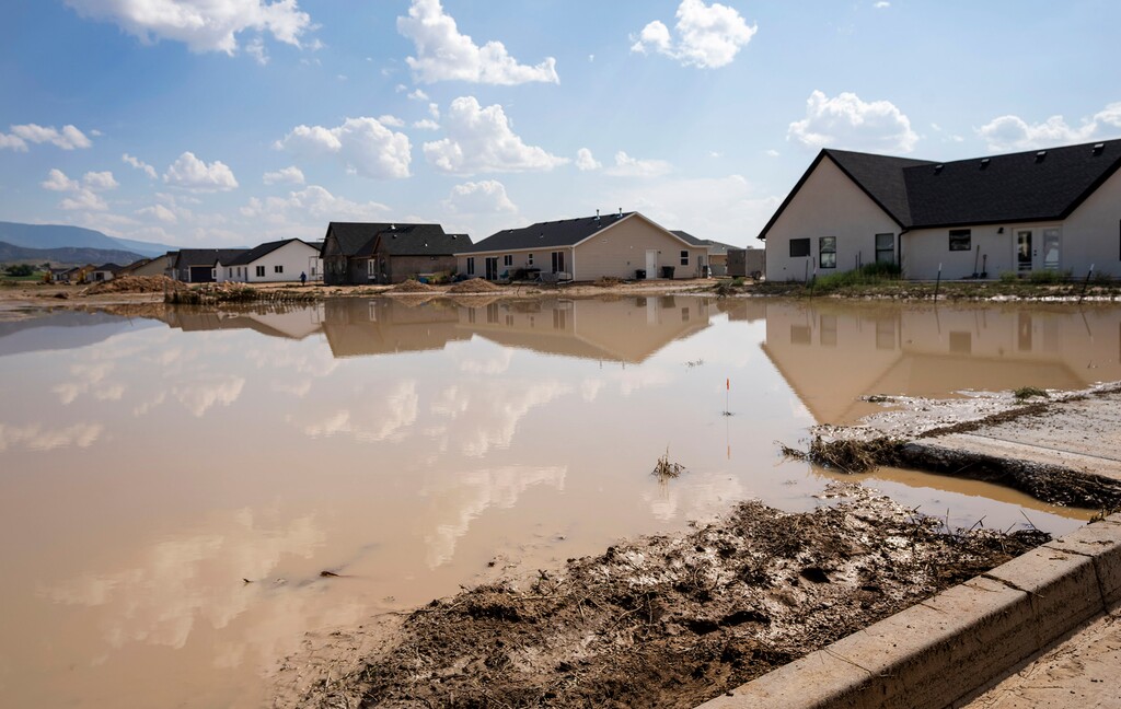 (Rick Egan | The Salt Lake Tribune) Standing water in a neighborhood of Enoch, from the heavy rains on Monday, Aug. 2, 2021.