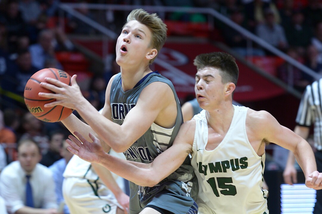 (Leah Hogsten  |  The Salt Lake Tribune) Olympus' Rylan Jones (15) tries to make the steal. Olympus defeated Corner Canyon 76-49 to win the 5A High School BoysÕ Basketball Tournament Championship at the Jon M. Huntsman Center in Salt Lake City,  Saturday, March 3, 2018. 