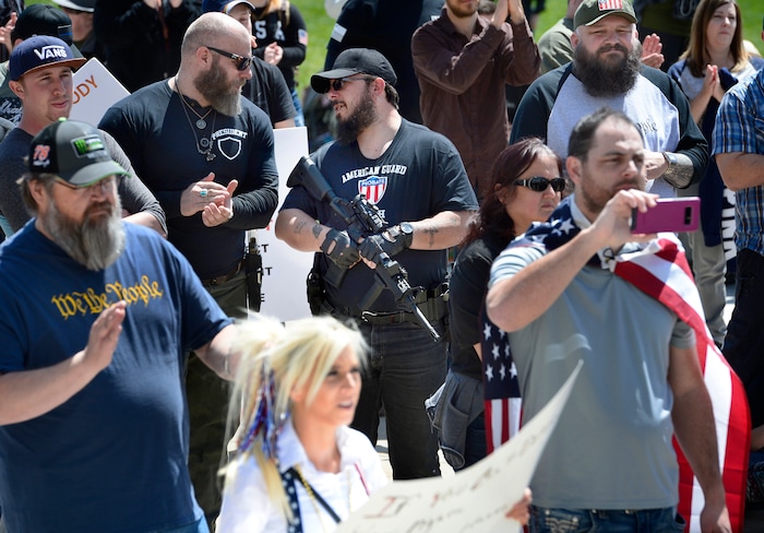 (Scott Sommerdorf | The Salt Lake Tribune)
Two armed men talk as a group calling themselves Citizens and Students For Liberty (SFL) gathered at the Utah State Capitol on Saturday to show their support for the Second Amendment, Saturday, April 14, 2018.