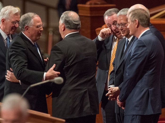(Rick Egan  |  The Salt Lake Tribune)          Members of the Quorum of the Twelve gather along with new Apostles, Elder Gerrit W. Gong and Elder Ulisses Soares, after the Saturday morning session of the188th Annual General Conference in Salt Lake City,  Saturday, March 31, 2018.