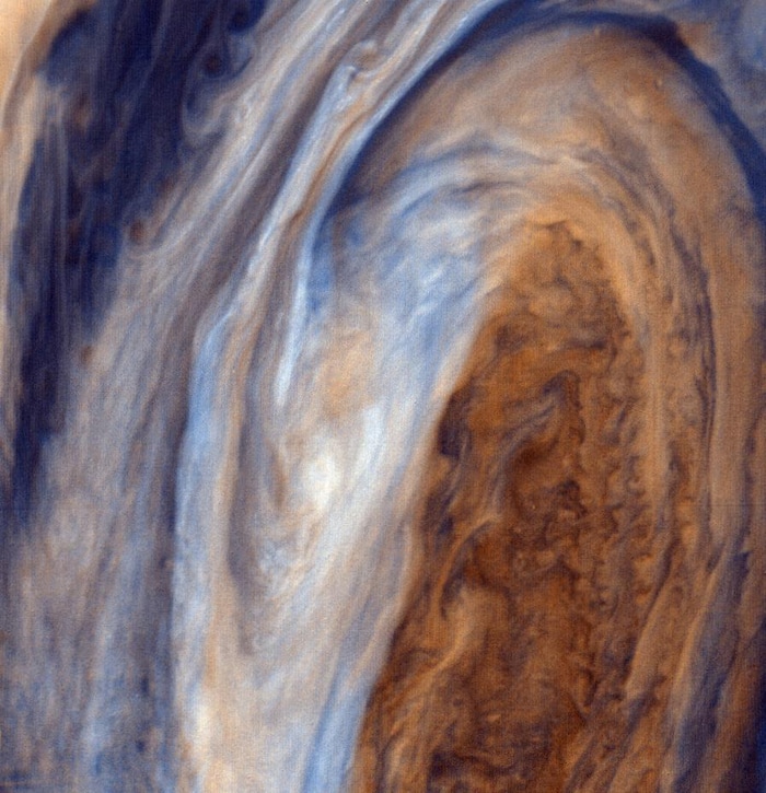 (Credit: Courtesy of NASA/Jet Propulsion Laboratory) This view of the Great Red Spot is seen in greatly exaggerated color. The colors do not represent the true hues seen in the Jovian atmosphere but have been produced by special computer processing to enhance subtle variations in both color and shading.