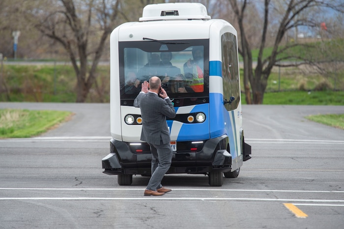 (Rick Egan  |  The Salt Lake Tribune)   Lt. Governor Spencer J. Cox walks in front of an Autonomous Shuttle, to see if it will stop for him, during a demonstration as the Utah Department of Transportation, in partnership with the Utah Transit Authority, launched a new Autonomous Shuttle Pilot Project at the test track is across the street from UDOT headquarters on the west side of 2700 West. Thursday, April 11, 2019.


