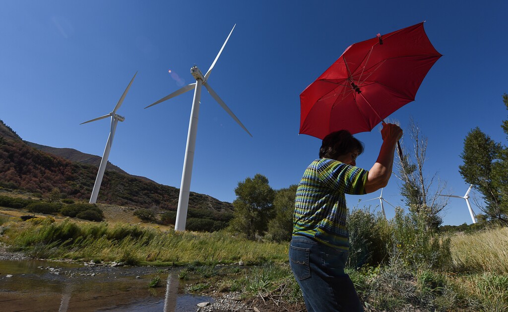(Francisco Kjolseth | The Salt Lake Tribune) Rocky Mountain Power hosts a tours to tout its Blue Sky clean energy program with a bus trip to the wind farm at the base of Spanish Fork canyon. Rocky Mountain Power contracts to buy the power from the station with nine wind mills, which at capacity generates 18.9 megawatts an hour.