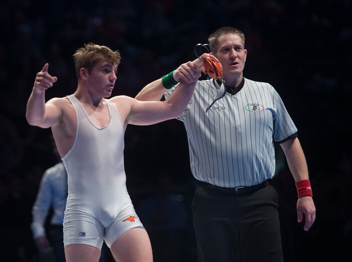 (Rick Egan  |  The Salt Lake Tribune)  Tanner Lofthouse (Mountain Crest) celebrates his victory over Isaac Semadeni (Logan)in the 160 weight class, in the 4A State Wrestling Championships at UVU in Orem, Saturday, February 10, 2018.
