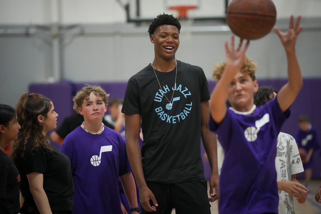 (Bethany Baker  |  The Salt Lake Tribune) Utah Jazz rookie Ace Bailey laughs as he works with kids during a basketball clinic with new Utah Jazz rookies at the Boys and Girls Club of Greater Salt Lake in Murray on Tuesday, July 1, 2025.