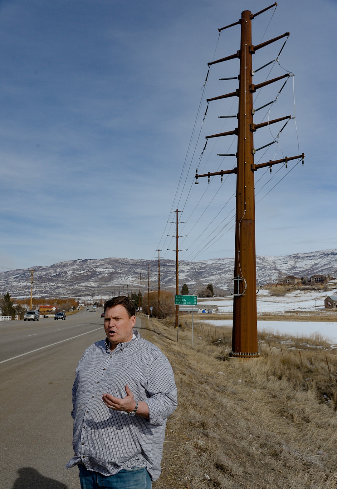 (Francisco Kjolseth  |  The Salt Lake Tribune)  A large high powered dual 138-kV turn line power pole stands on the edge of Heber City as Midway residents, including Bengt Jonsson, talks about trying to convince Rocky Mountain Power to bury part of the transmission line the utility wants to build through the scenic Heber Valley town to the west. They are even willing to cover the cost, but the utility is challenging the town's requirement that the new line go underground.