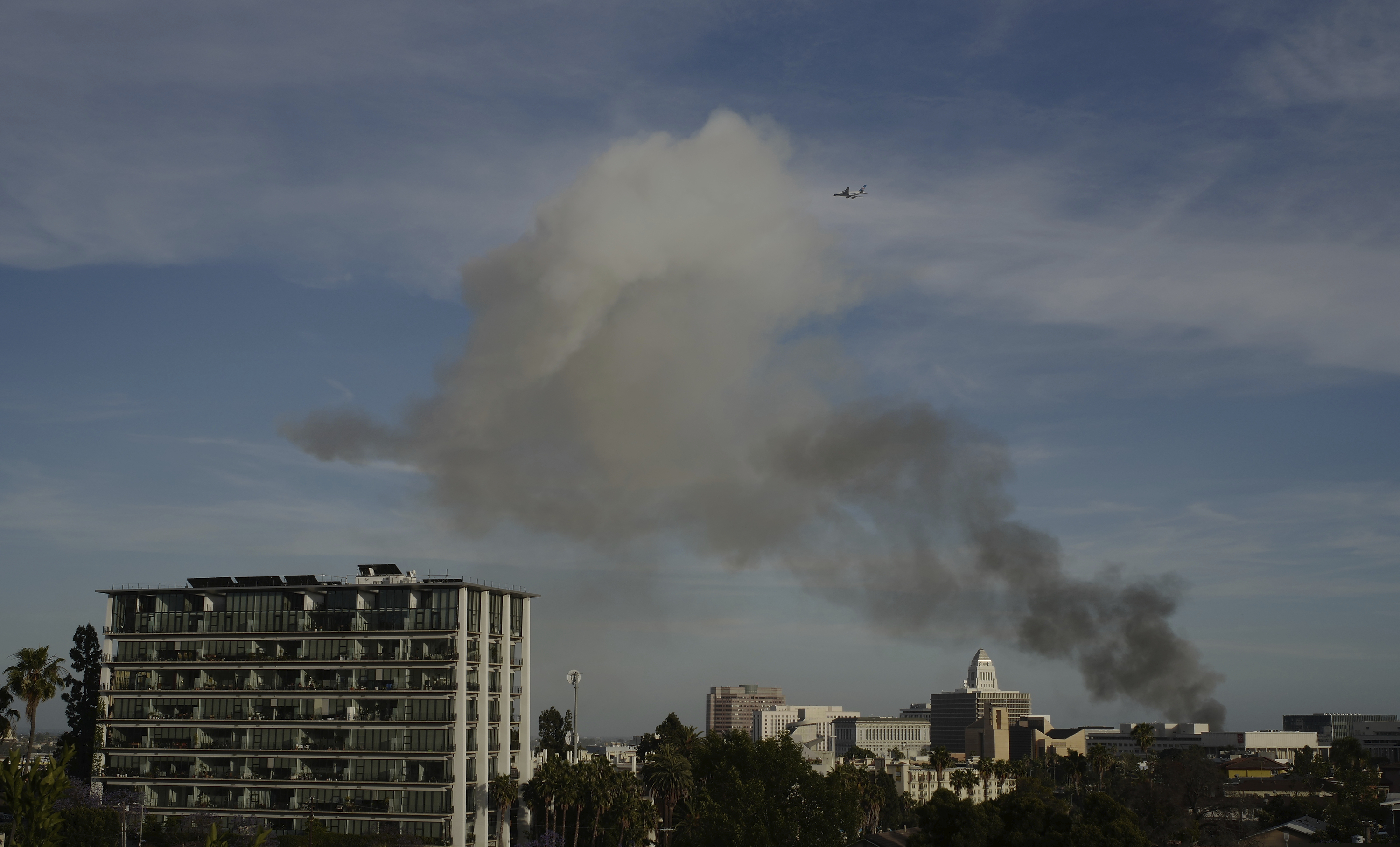 (Damian Dovarganes | AP photo)
Smoke rises from an explosion at a structure fire Saturday, May 16, 2020, in Los Angeles.