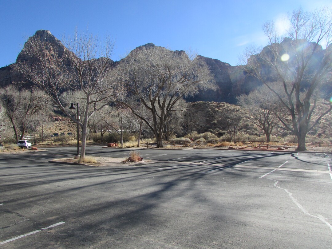 (Tom Wharton | The Salt Lake Tribune) A mostly empty parking lot at the Zion National Park Visitor Center is a rare site, but with the visitor center and restrooms closed, there was little reason to visit except to look at outdoor exhibits or pick up a park newspaper. Park services have been reduced because of a federal government shutdown that went into effect at midnight Friday after the Senate was unable to pass a new spending bill.