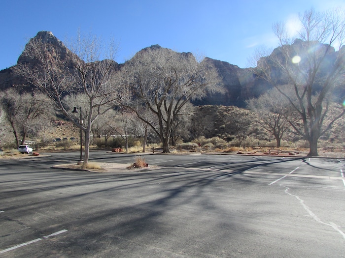 (Tom Wharton | The Salt Lake Tribune) A mostly empty parking lot at the Zion National Park Visitor Center is a rare site, but with the visitor center and restrooms closed, there was little reason to visit except to look at outdoor exhibits or pick up a park newspaper. Park services have been reduced because of a federal government shutdown that went into effect at midnight Friday after the Senate was unable to pass a new spending bill.