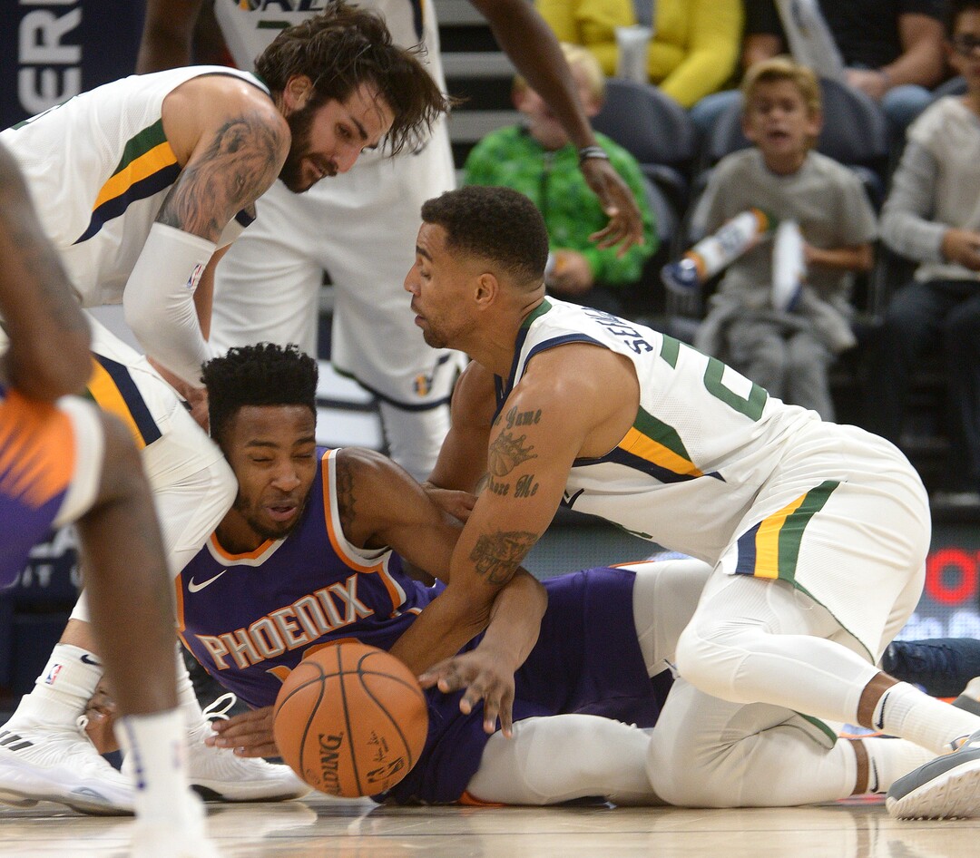 (Leah Hogsten  |  The Salt Lake Tribune) Utah Jazz guard Ricky Rubio (3) and Utah Jazz forward Thabo Sefolosha (22) pressure Phoenix Suns forward Derrick Jones Jr. (10) for the ball. The Utah Jazz defeated the Phoenix Suns 112-101 during preseason NBA basketball at Vivint Smart Home Arena in Salt Lake City, October 6, 2017.