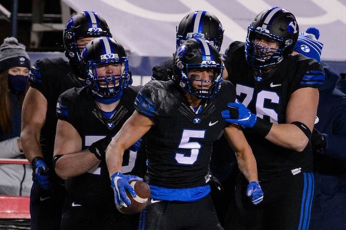 (Trent Nelson | The Salt Lake Tribune) Brigham Young Cougars wide receiver Dax Milne (5) celebrates a reception as BYU hosts San Diego State, NCAA football in Provo on Saturday, December 12, 2020.