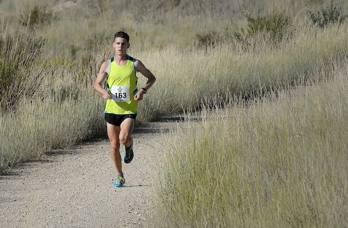 (Scott Sommerdorf | The Salt Lake Tribune) Reed Muir is way ahead of the field, and went on to win the Heber Creeper train 12k race. The runners raced toward the finish line near the Soldier Hollow train station after starting at the Deer Creek Dam, Saturday, August 19, 2017.