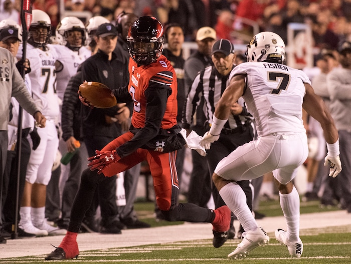 Utah Utes wide receiver Darren Carrington II (9) tries to get past Colorado Buffaloes defensive back Nick Fisher (7), in PAC-12 football action Utah Utes vs. Colorado Buffaloes at Rice-Eccles stadium, Saturday, November 25, 2017.