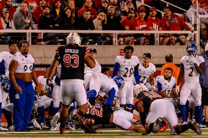 (Trent Nelson | The Salt Lake Tribune) Utah Utes linebacker Donavan Thompson (3) tackles San Jose State Spartans quarterback Montel Aaron (7) as the Utah Utes host the San Jose State Spartans, NCAA football at Rice-Eccles Stadium in Salt Lake City, Saturday September 16, 2017. Aaron left the game after this play.