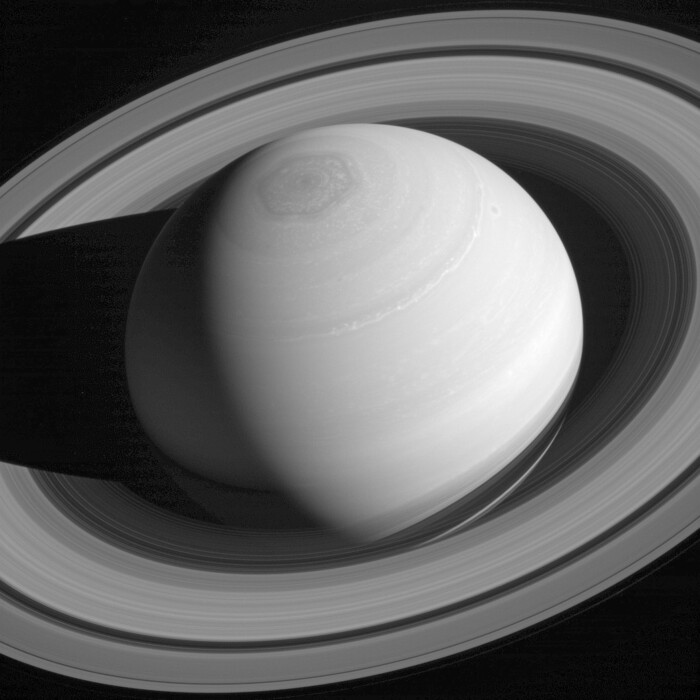 This May 4, 2014 image made available by NASA shows the persistent hexagonal cloud pattern on Saturn's north pole, as seen from the Cassini spacecraft. The hexagon is similar to Earth's polar vortex, which has winds blowing in a circular pattern around the polar region, and is nearly 25,000 kilometers (15,000 miles) across. Nearly four Earths could fit inside it. (NASA/JPL-Caltech/Space Science Institute via AP)