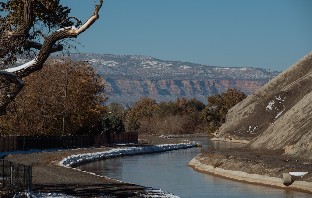 (Nick Cote | The New York Times) The Grand Valley Ditch, running through Grand Junction, Colo., diverts water from the Colorado River to irrigate farms, on Oct. 28, 2020.