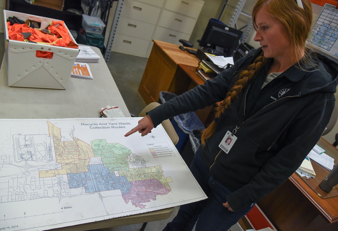 (Francisco Kjolseth  |  The Salt Lake Tribune)  Jen Farrell, lead outreach and education specialist for Salt Lake City Corporation Sanitation Division points out the different regions around the city that they service for recycling. 