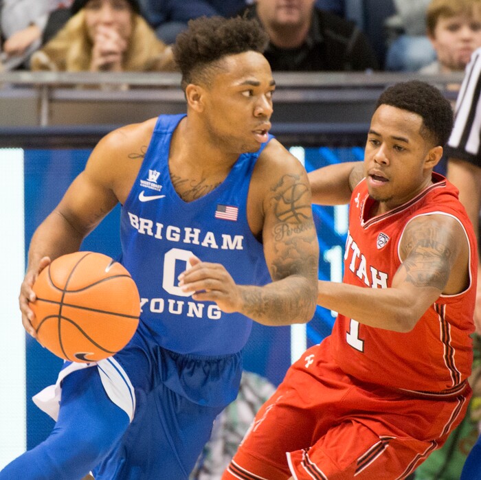 (Rick Egan  |  The Salt Lake Tribune)   Utah Utes guard Justin Bibbins (1) guards Brigham Young Cougars guard Jahshire Hardnett (0), in basketball action Utah Utes vs. Brigham Young Cougars at the Marriott Center in Provo, Saturday, December 15, 2017.


