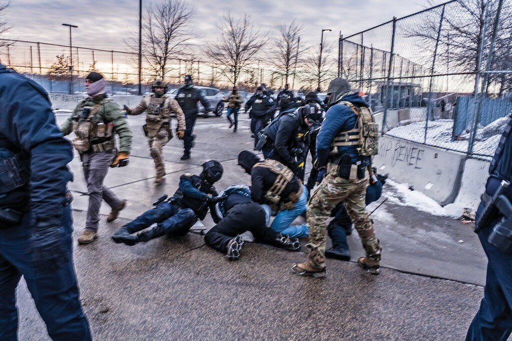 Federal agents detain a demonstrator outside of the Whipple Federal Building in Minneapolis, Jan. 17, 2026. (Mark Peterson/The New York Times)