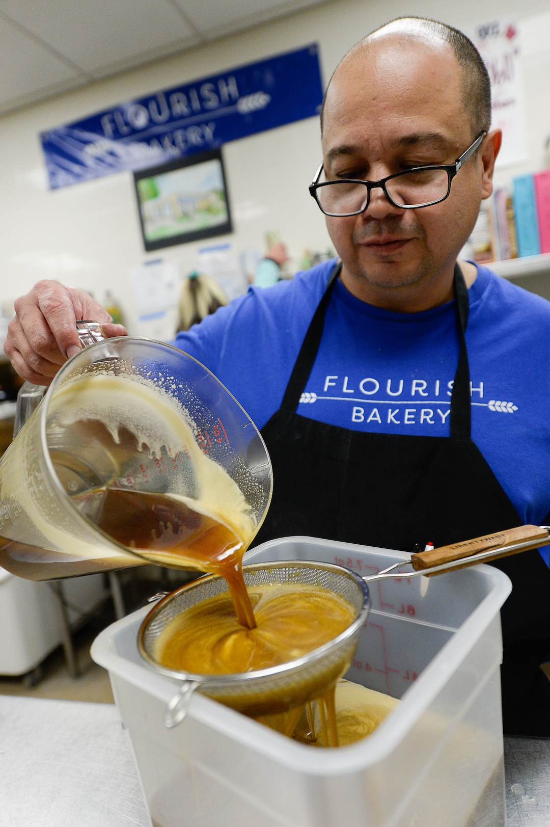 (Francisco Kjolseth  |  The Salt Lake Tribune)  Dennis Sisneros, an intern at Flourish Bakery puts away ingredients from a large pecan pie order during a rush to get them done before the Thanksgiving holiday on Tuesday, Nov. 26, 2019. Flourish Bakery needs to find a new home before Christmas. The non-profit bakery teaches those who have been incarcerated or recovering from substance abuse the art of baking. The skills they learn help them get a job and become financially independent. The bakery has been housed at SLCC's South City campus, but the college has said they can no longer use the space.