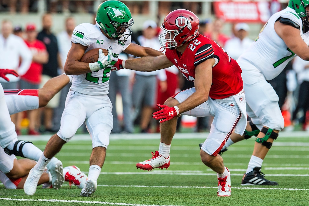 (Chris Detrick  |  The Salt Lake Tribune)  Utah Utes defensive back Chase Hansen (22) chases down North Dakota Fighting Hawks running back John Santiago (22) during the game at Rice-Eccles Stadium Thursday, August 31, 2017. Utah Utes are leading North Dakota Fighting Hawks 17-9 at halftime. 