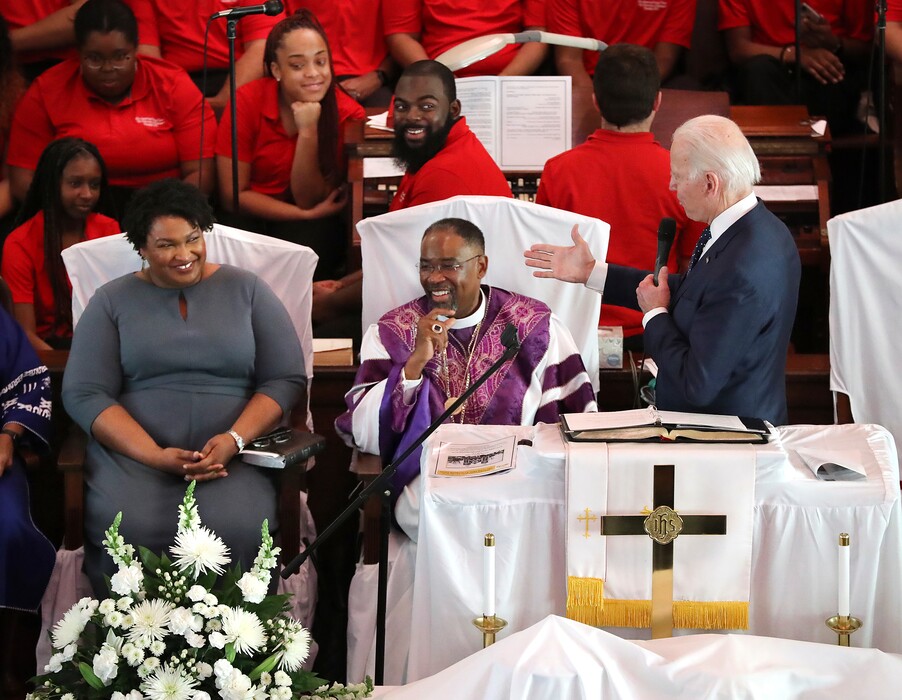 Democratic presidential candidate and former Vice President Joe Biden, right, pays compliments to former Georgia gubernatorial candidate and former state Rep. Stacey Abrams while speaking at Brown Chapel African Methodist Episcopal Church, Sunday, March 1, 2020, in Selma, Ala. (Curtis Compton/Atlanta Journal-Constitution via AP)