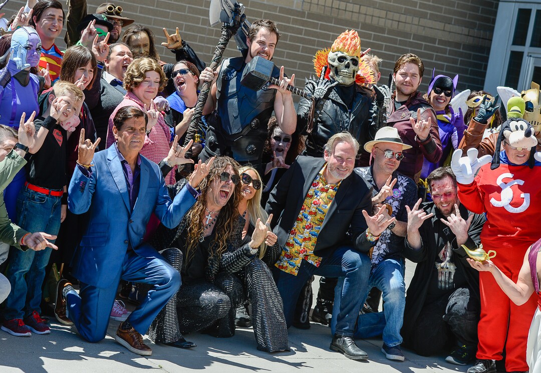 (Francisco Kjolseth  |  The Salt Lake Tribune)  Voice actor Jess Harnell, center left, joins producers, Bryan Brandenburg, below left, and Dan Farr, below right, along with numerous cosplayers for FanX's twice-annual "press conference," which draws cosplayers to Megaplex Jordan Commons in Sandy on Wed. June 12, 2019, for the announcement of the event's celebrity visitors.