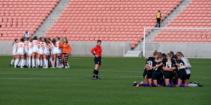 (Chris Samuels | The Salt Lake Tribune) Skyridge and Riverton huddle before the 6A girls’ soccer state championships at Rio Tinto Stadium in Sandy, Friday, Oct. 22, 2021.