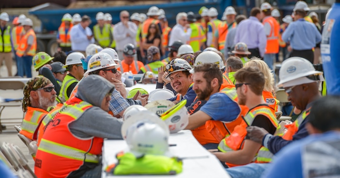 (Leah Hogsten  |  The Salt Lake Tribune) Thousands of workers from all trades attended Wednesday's "topping out" ceremony to raise the last steel beams to a high point on the new Salt Lake City International Airport terminal building, Wednesday, May 23, 2018. The new $485 million terminal building will cover 866,087 square feet and used 11,000 tons of structural steel and 22 miles of steel piles.