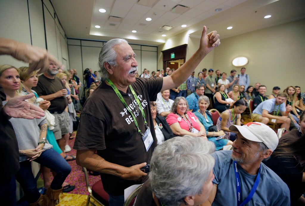 (Rick Bowmer | AP file photo) Willie Grayeyes raises his hand as he is recognized during a news conference, in Salt Lake City on Nov. 4, 2016. Grayeyes, running for San Juan County commissioner, was originally disqualified from the ballot because of where he lived. He fought that based on the argument that local voting districts were illegally drawn based on race.