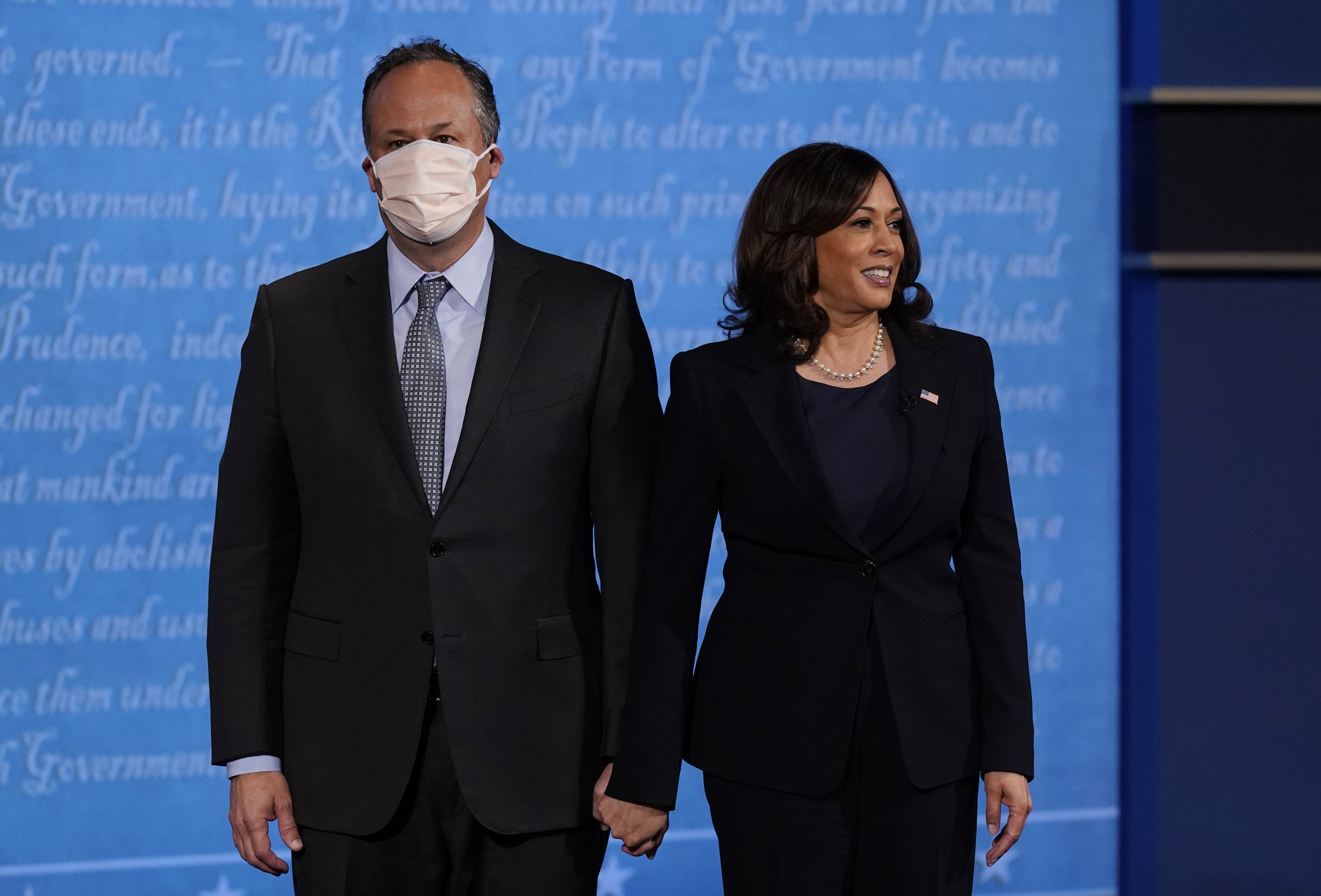 FILE - In this Oct. 7, 2020, file photo, Democratic vice presidential candidate Sen. Kamala Harris, D-Calif., stands with her husband Douglas Emhoff during the vice presidential debate with Vice President Mike Pence at Kingsbury Hall on the campus of the University of Utah in Salt Lake City. Harris made history Saturday, Nov. 7,  as the first Black woman elected as vice president of the United States, shattering barriers that have kept men — almost all of them white — entrenched at the highest levels of American politics for more than two centuries. (AP Photo/Patrick Semansky, File)