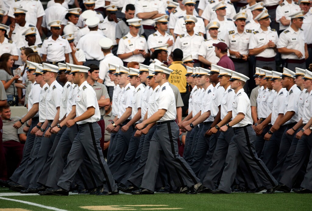 In this Friday, Sept. 4, 2015, photo, cadets march into Michie Stadium before an NCAA college football game between Army and Fordham in West Point, N.Y. An annual freshman pillow fight at the U.S. Military Academy turned bloody this year when cadets swung pillowcases packed with hard objects, injuring 30 cadets, according to a New York Times report, Saturday, Sept 5. (AP Photo/Mike Groll)