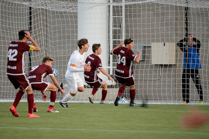 (Trent Nelson | The Salt Lake Tribune)  Judge Memorial's Jack Terrill and a group of Morgan defenders react to Joseph Paul's game-winning goal in the 3A state championship game, Saturday May 12, 2018.