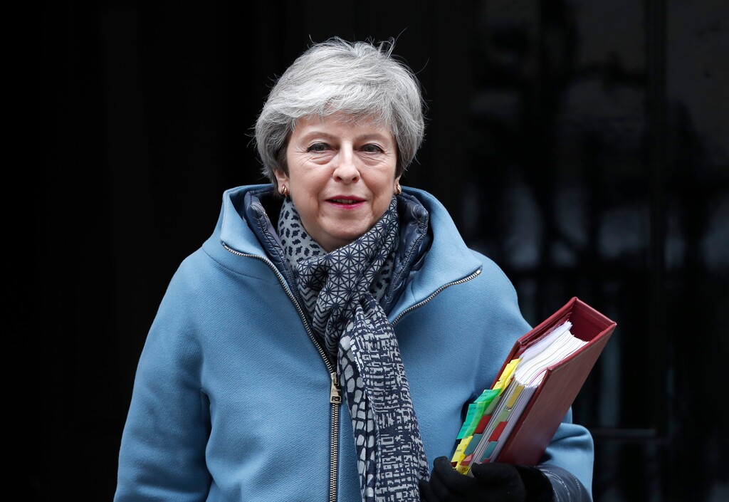 (AP Photo/Alastair Grant) Britain's Prime Minister Theresa May leaves 10 Downing street to attend her weekly Prime Minster's Questions at the House of Commons, in London, Wednesday, March 27, 2019.  British lawmakers are preparing to vote Wednesday on alternatives for leaving the European Union as they seek to end an impasse following the overwhelming defeat of the deal negotiated by Prime Minister Theresa May.