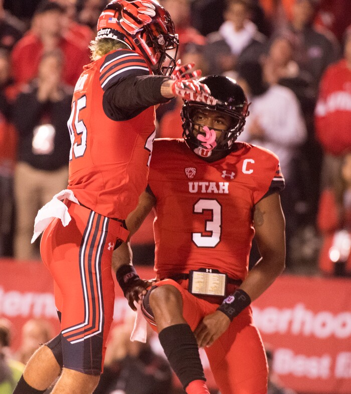 Utah quarterback Troy Williams (3) celebrates his touchdown with Utah Utes wide receiver Samson Nacua (45), in PAC-12 football action Utah Utes vs. Colorado Buffaloes at Rice-Eccles stadium, Saturday, November 25, 2017.
