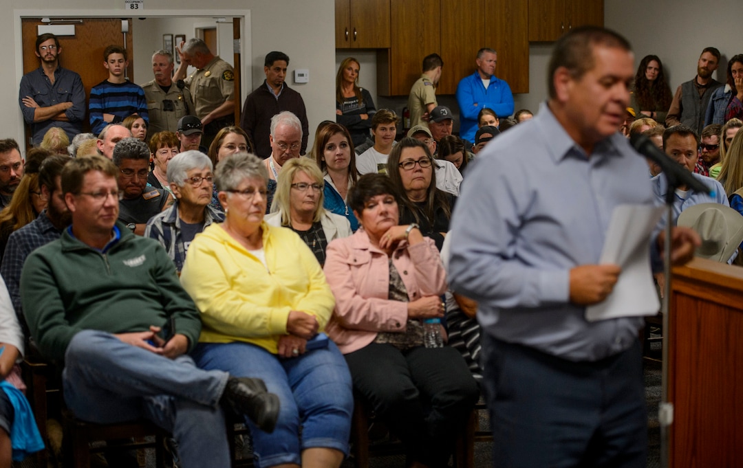 (Steve Griffin  |  The Salt Lake Tribune)  Northwest Band Tribal Council Chairman, Darren Parry, right, addresses the  Wellsville City Council about his concerns with the Sham Battle Wednesday night at the Wellsville City Hall in Wellsville, Utah Wednesday September 20, 2017. The mayor and the city council created a committee to decide the future of the Sham Battle where white residents paint their bodies red, put on war paint, and whoop and fire guns, attacking the humble settlers before being driven off by the cavalry troops. 