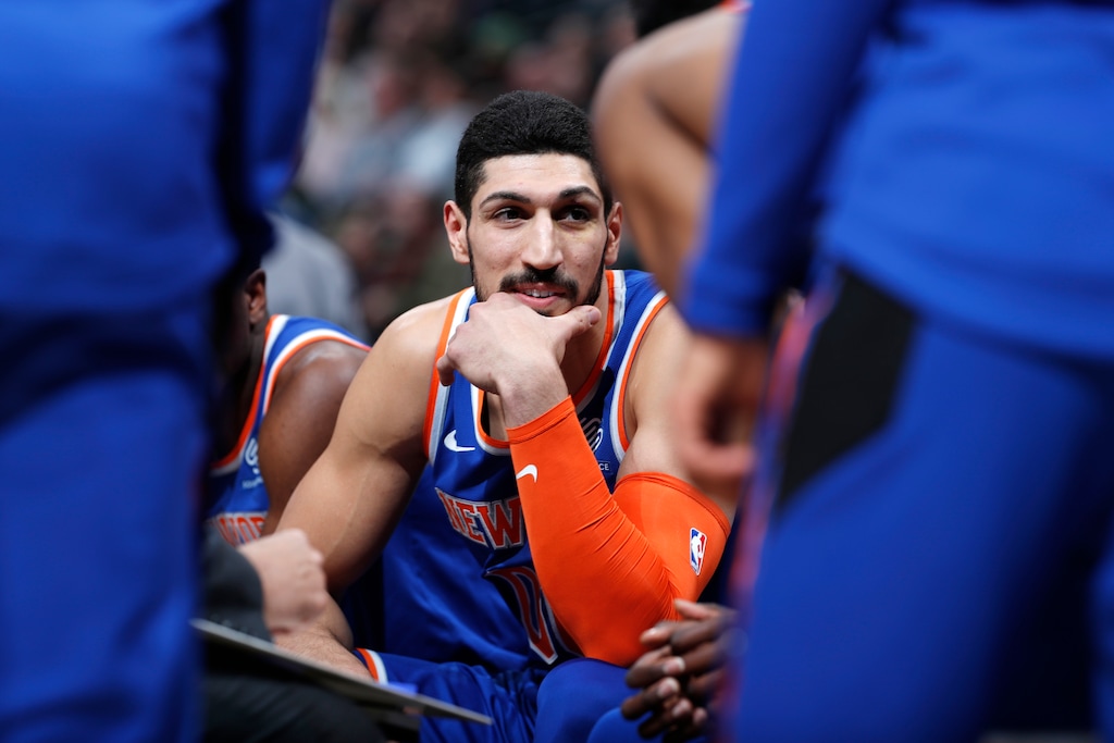 FILE - In this Jan. 1, 2019, file photo, New York Knicks centre Enes Kanter, of Turkey, jokes with teammates during a timeout the first half of the team's NBA basketball game against the Denver Nuggets, in Denver.  Turkish media reports said Wednesday, Jan. 16, 2019, that Turkish prosecutors are seeking an international arrest warrant and had prepared an extradition request for Kanter, accusing him of membership in a terror organisation. Sabah newspaper said prosecutors were seeking an Interpol "Red Notice" citing Kanter's ties to Fethullah Gulen, who Turkey blames for a failed 2016 coup, and accusing him of providing financial support to his group. (AP Photo/David Zalubowski, File)