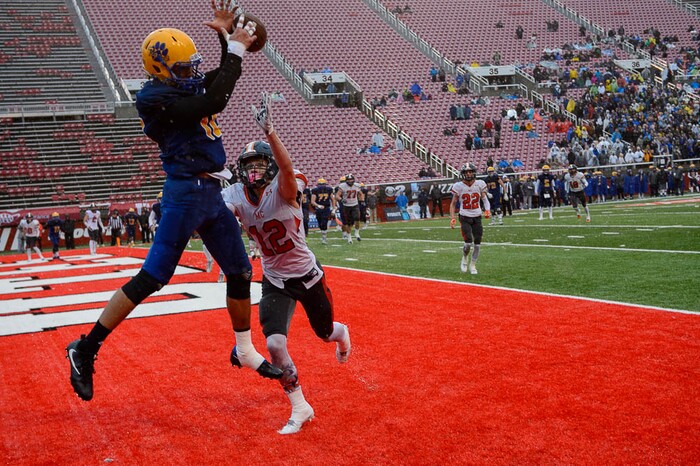 (Trent Nelson | The Salt Lake Tribune)  Orem's Puka Nacua (12) tries to catch a pass in the end zone as Orem faces Mountain Crest in the Class 4A High School State Football Championship game in Salt Lake City, Friday November 17, 2017. Mountain Crest's Cameron Moser (12) defending.