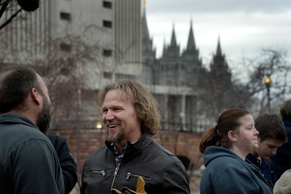(Scott Sommerdorf   |  The Salt Lake Tribune) Polygamist Kody Brown and his family marched across State Street near the LDS Church Office Building in order to meet up with other polygamists and supporters before marching to the Capitol, where they held a rally, Friday, Feb. 10, 2017.