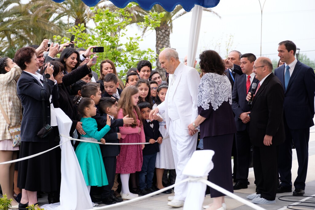 (Courtesy photo | The Church of Jesus Christ of Latter-day Saints)
President Russell M. Nelson and his wife, Wendy, greet children during the cornerstone ceremony for the dedication of the Concepción Chile Temple, Sunday, Oct. 28, 2018. The Nelsons are returning to South America for an Aug. 24-Sept. 2 tour in 2019.