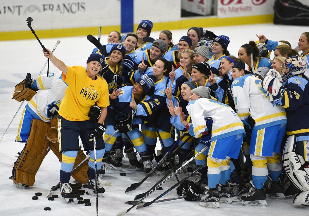 FILE - In this Sunday, Jan. 24, 2016, file photo, National Women's Hockey League (NWHL) All-Star players take time for a photo before an all-star game in Buffalo, N.Y. The New Jersey Devils recently announced their partnership with the Metropolitan Riveters, one of four teams in the fledgling NWHL. (AP Photo/Gary Wiepert, File)