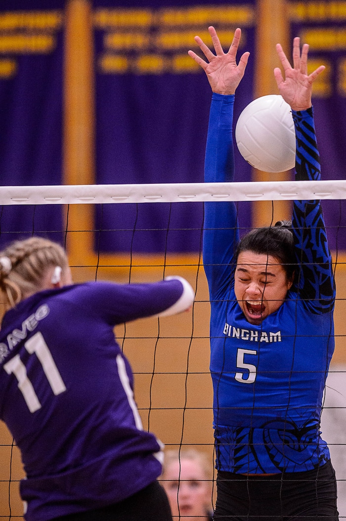 (Trent Nelson  |  The Salt Lake Tribune)  North Summit's Brecklyn Murdock (11) hits the ball past Bingham's Talia Myers (5) as North Summit hosts Bingham, high school girls' volleyball in Coalville, Thursday August 17, 2017.