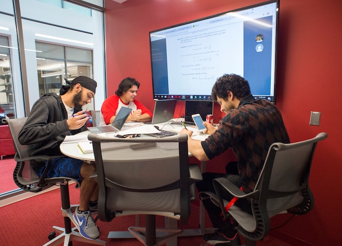 (Rick Egan  |  The Salt Lake Tribune)     Tyler Crum, Nirmole Tambhar and  Mahdi Sofla study in a study room at the new Gary and Ann Crocker Science Center at the University of Utah, Thursday, April 19, 2018.



