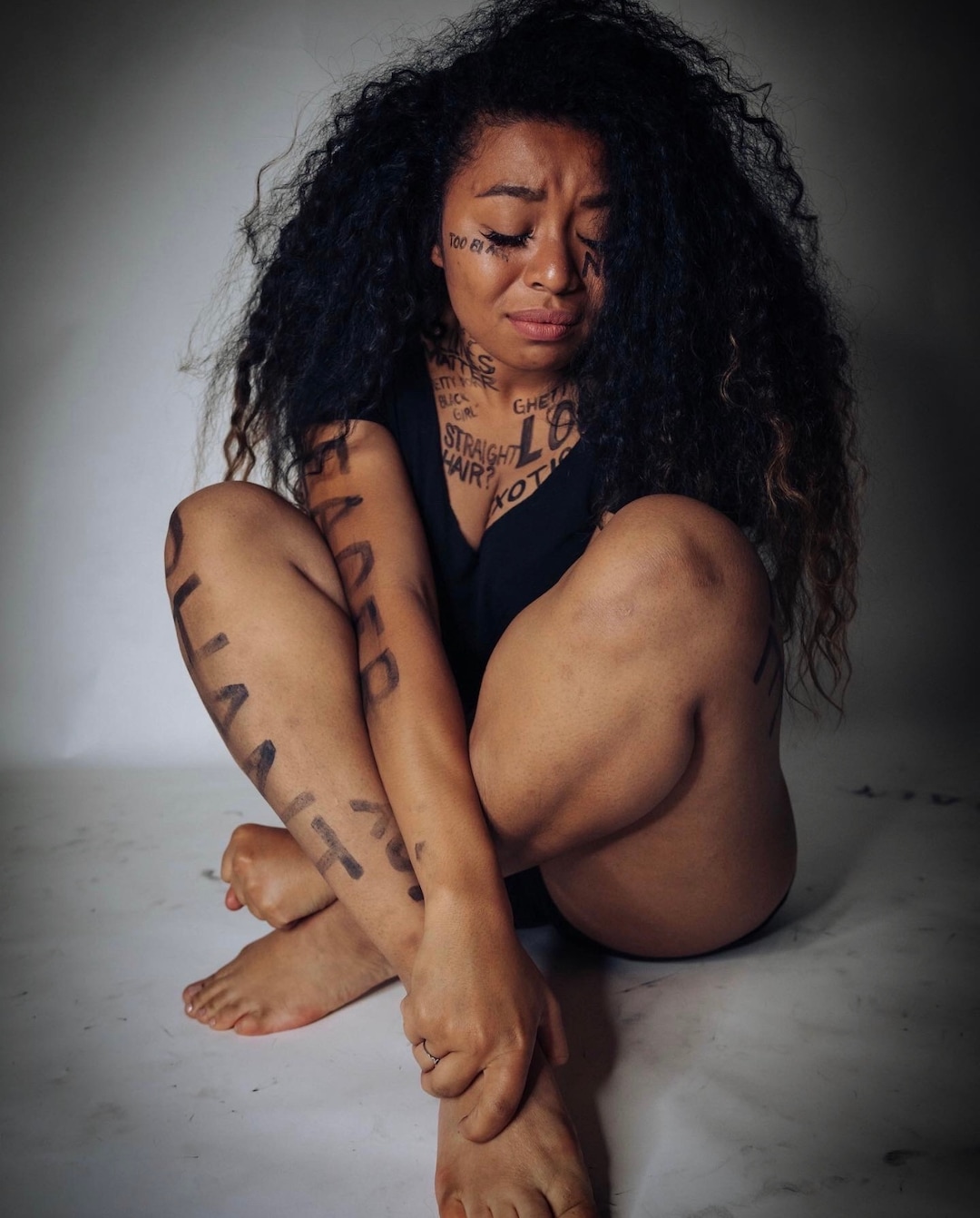 (Photo courtesy of Ana Brown Photo + Film) Stephanie Nguyen Lake cries during a photoshoot used to raise awareness for negative stereotypes black women are associated with.