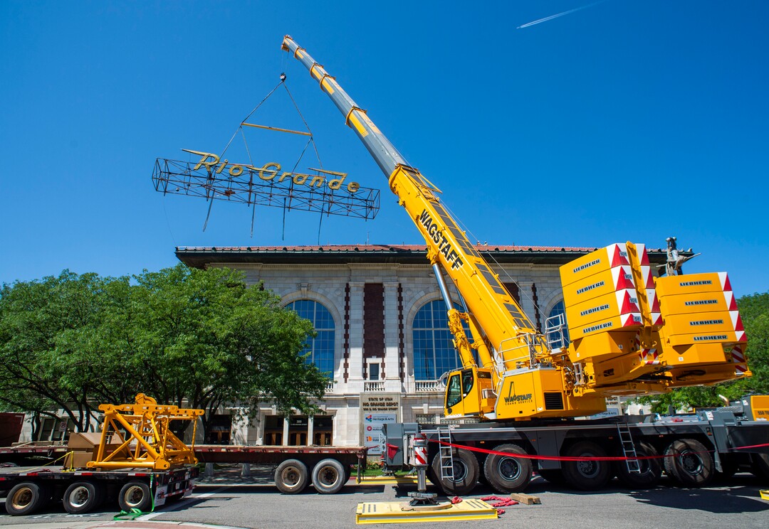 (Rick Egan  |  The Salt Lake Tribune)     The  neon Rio Grande sign that has shined from the rooftop of the Rio Grande Depot for more than 50 years is removed from the building, Monday, Aug. 12, 2019.